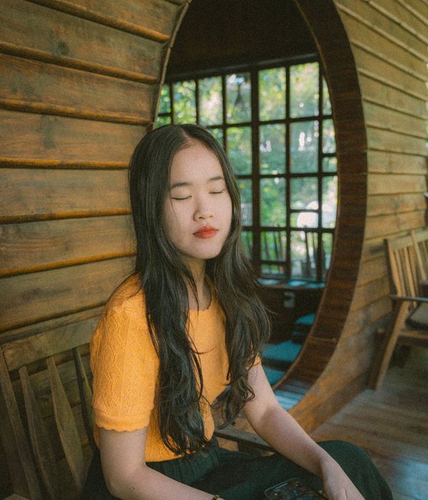 Woman looking peacefully into the distance with relaxed eyes